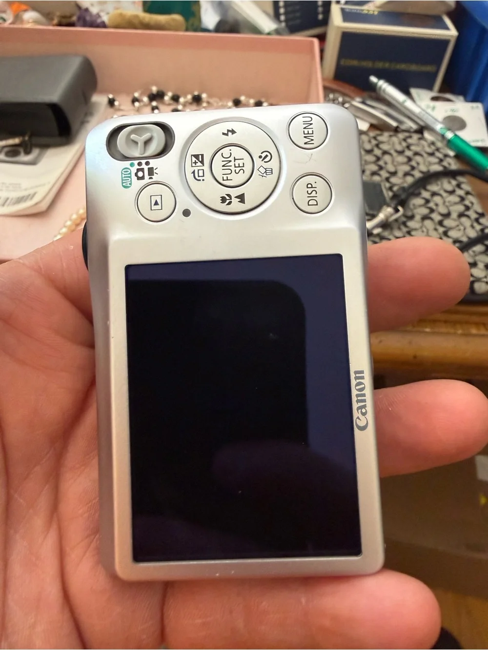Silver Canon PowerShot SD1300 IS Digital ELPH camera.